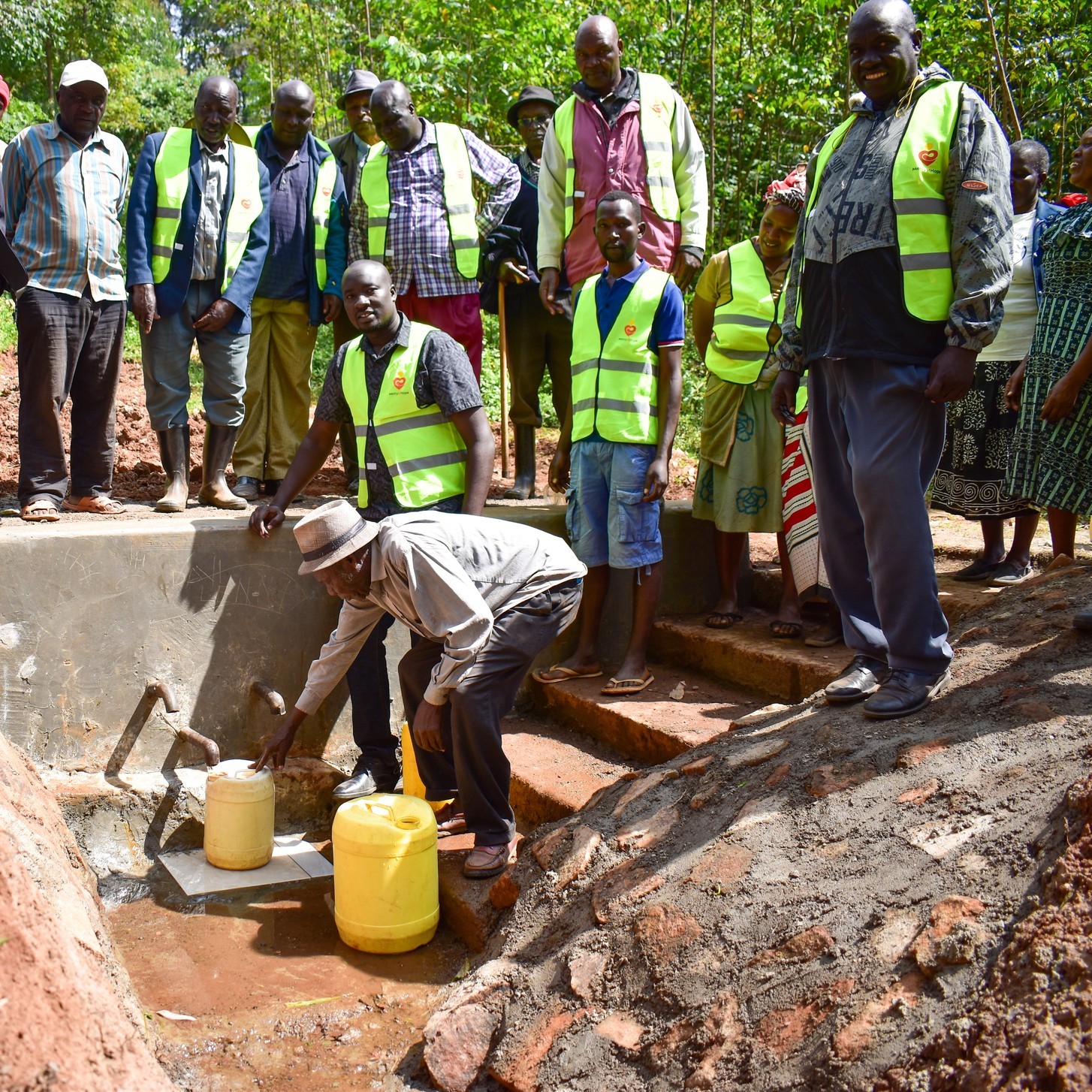Community members at a clean water point in Kisii